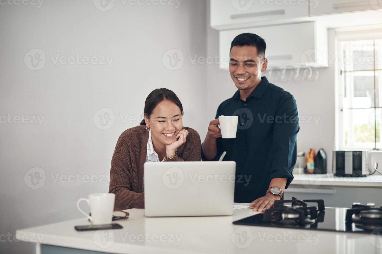 Happy couple reviewing their refinance options