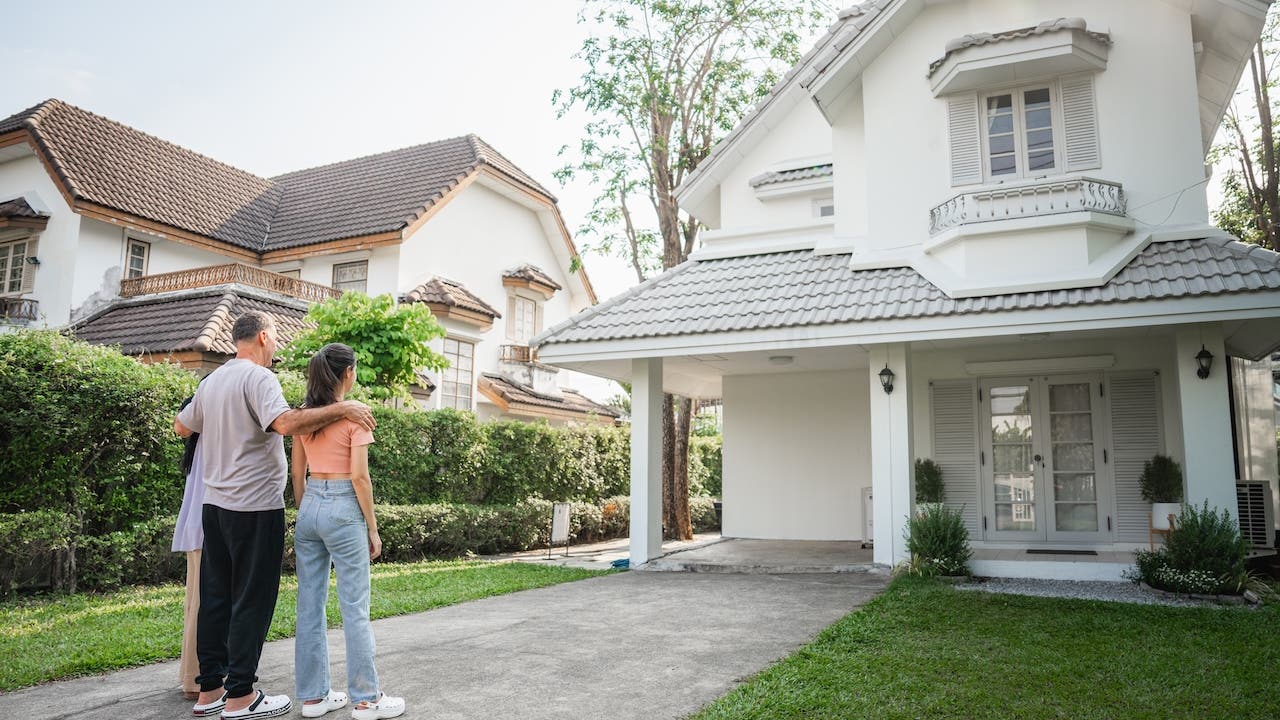 Happy homeowners after successful refinance