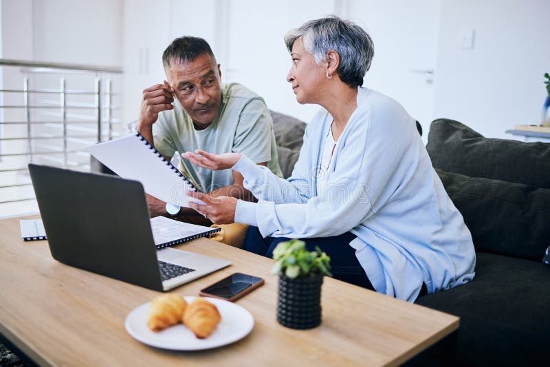 Couple reviewing refinancing documents together